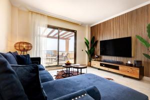 Et tv og/eller underholdning på Panoramic Sea Views Penthouse