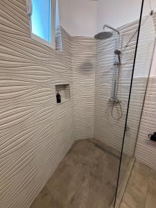 a shower with a glass door in a bathroom at MaRailiS Port Apart Mangalia in Mangalia +70 photos