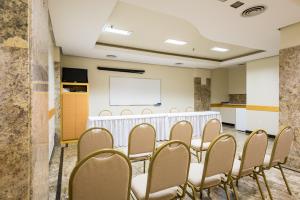 a conference room with a white table and chairs at Hotel Vermont Ipanema in Rio de Janeiro