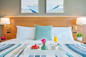 a hotel room with a tray of food on a bed at MVR - The Best of Work Relaxation in One in Miami