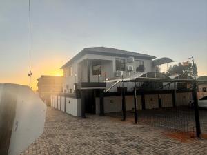 a house with a fence in front of it at The86thGuest Krugersdorp in Krugersdorp