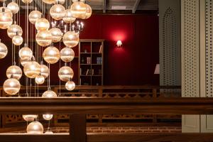 a room with a bunch of lights hanging from the ceiling at Agarani Estate in Telavi