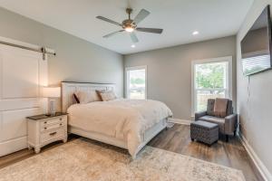 a bedroom with a bed and a ceiling fan at Modern Family Home with Spacious Yard in Milton in Ferry Pass