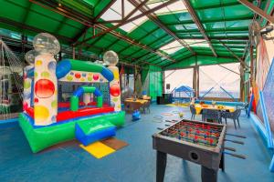 a childrens play area with a inflatable bounce at São Paulo Ibirapuera Convention Plaza 02 Banheiros in São Paulo