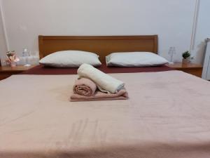 Postel nebo postele na pokoji v ubytování Rooms royal