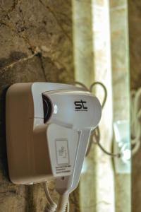 a camera on the side of a stone wall at MAKIS Luxury Apartments City Center Free Parking in Ohrid +33 photos