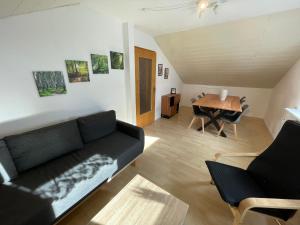 a living room with a couch and a table at Ferienwohnung Wehra in Todtmoos in Todtmoos