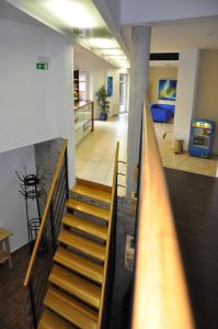 Tempat tidur dalam kamar di Hotel Lions Plzen