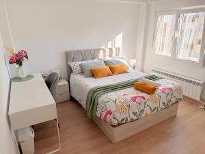 En eller flere senge i et værelse på Apartamento Luna