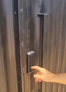 a persons hand pointing to a metal object at Capella Home in São Miguel do Gostoso