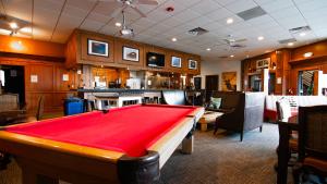 a pool table in a room with a bar at Park City Hostel in Park City