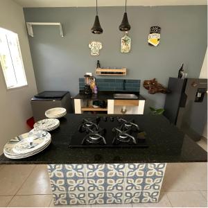 a kitchen with a black counter top with a stove at Hotel Boutique Tierra Del Mar Cartagena in Cartagena de Indias +20 photos