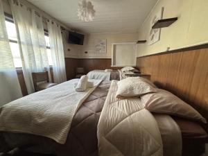 Postel nebo postele na pokoji v ubytování Hospedaje Colón