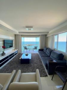 Posezení v ubytování Apartamento Alto padrão Frente Mar + 47 fotografií