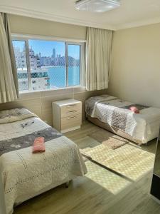 Katil atau katil-katil dalam bilik di Apartamento Alto padrão Frente Mar