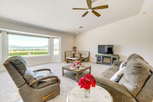 a living room with two couches and a tv at Steps to Clear Lake Hot Tub Haven in NorCal! in Lakeport