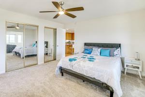 a bedroom with a bed and a ceiling fan at Steps to Clear Lake Hot Tub Haven in NorCal! in Lakeport