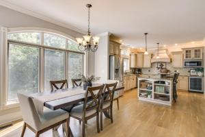 a kitchen and dining room with a table and chairs at Dock and Home Theater Pet-Friendly Lake Wylie Home in Fort Mill