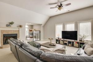a living room with a couch and a tv at Dock and Home Theater Pet-Friendly Lake Wylie Home in Fort Mill