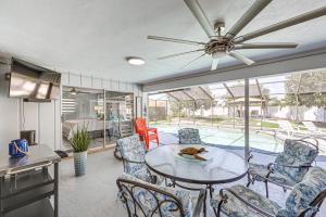 a kitchen and dining room with a table and chairs at Outdoor Oasis Marco Island Home Near Beaches in Marco Island