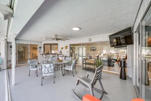 a living room with a table and chairs at Outdoor Oasis Marco Island Home Near Beaches in Marco Island