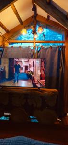 a man standing in the middle of a room at Cabaña en La Calera con Jacuzzi in La Calera
