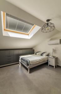 Un pat sau paturi într-o cameră la Les Demeures de Castellane