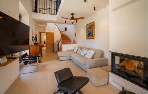 a living room with a couch and a fireplace at Can Sivella Groc in Sóller