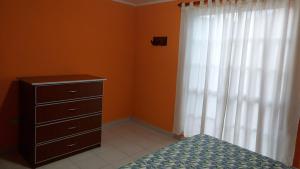 En eller flere senge i et værelse på Casa Painanbi