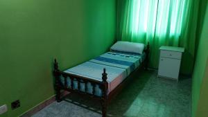 En eller flere senge i et værelse på Casa Painanbi