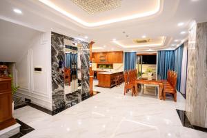 a kitchen and dining room with a table and chairs at TSUBAKI VILLA nha trang in Nha Trang