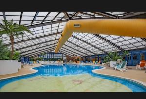 a large swimming pool in a large building at Gbk caravans in Rhyl