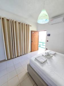 Voodi või voodid majutusasutuse Azure Hotel Dhermi toas