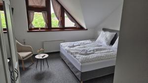 Ліжко або ліжка в номері Hotel Radnice Dobrovice