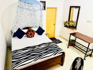 A bed or beds in a room at Priyavimana resort