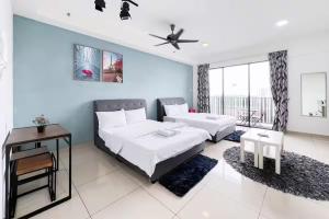 a bedroom with a bed and a couch at I-City Luxury Condominiums, Shah Alam by Smarthome in Shah Alam +158 photos
