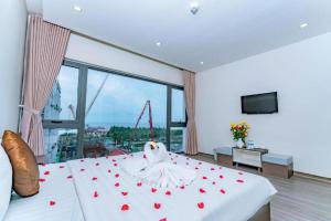 Postel nebo postele na pokoji v ubytování The Shann Hotel Danang