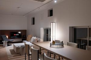 a living room with a table and chairs and a couch at JAPAVISTA r4 in Tokyo