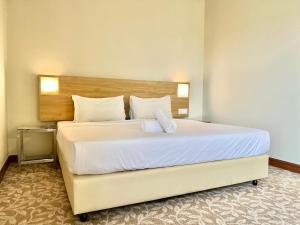 Postel nebo postele na pokoji v ubytování Kingston Hotel 10 - Bukit Jalil