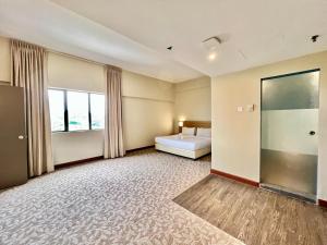 Postel nebo postele na pokoji v ubytování Kingston Hotel 10 - Bukit Jalil