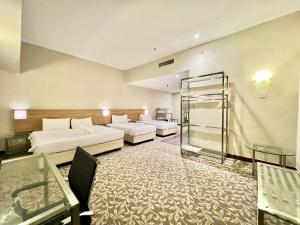 Postel nebo postele na pokoji v ubytování Kingston Hotel 10 - Bukit Jalil