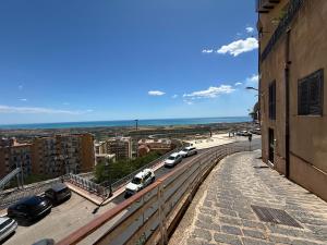 a view of a city with cars parked on a street at Appartamento in centro- Enea home in Agrigento