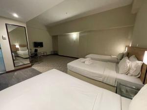 Postel nebo postele na pokoji v ubytování Kingston Hotel 10 - Bukit Jalil