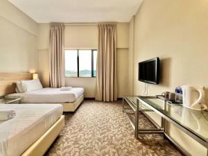 TV a/nebo společenská místnost v ubytování Kingston Hotel 10 - Bukit Jalil + 32 fotografií