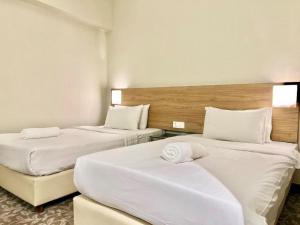 Postel nebo postele na pokoji v ubytování Kingston Hotel 10 - Bukit Jalil