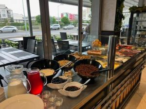 a buffet line with many different types of food at Persani Sunny Beach in Sunny Beach