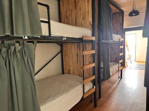 a couple of bunk beds in a room at Wanderlust District in Mexico City