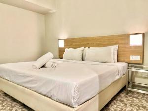 Postel nebo postele na pokoji v ubytování Kingston Hotel 10 - Bukit Jalil