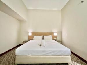 Postel nebo postele na pokoji v ubytování Kingston Hotel 10 - Bukit Jalil