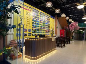 a lobby with a bar and a menu on the wall at Tam Coc Morning Homestay & Spa Ninh Binh in Vũ Lâm